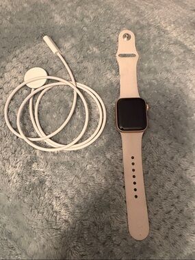 Smartwatch with Light tan Band and Magnetic Charger